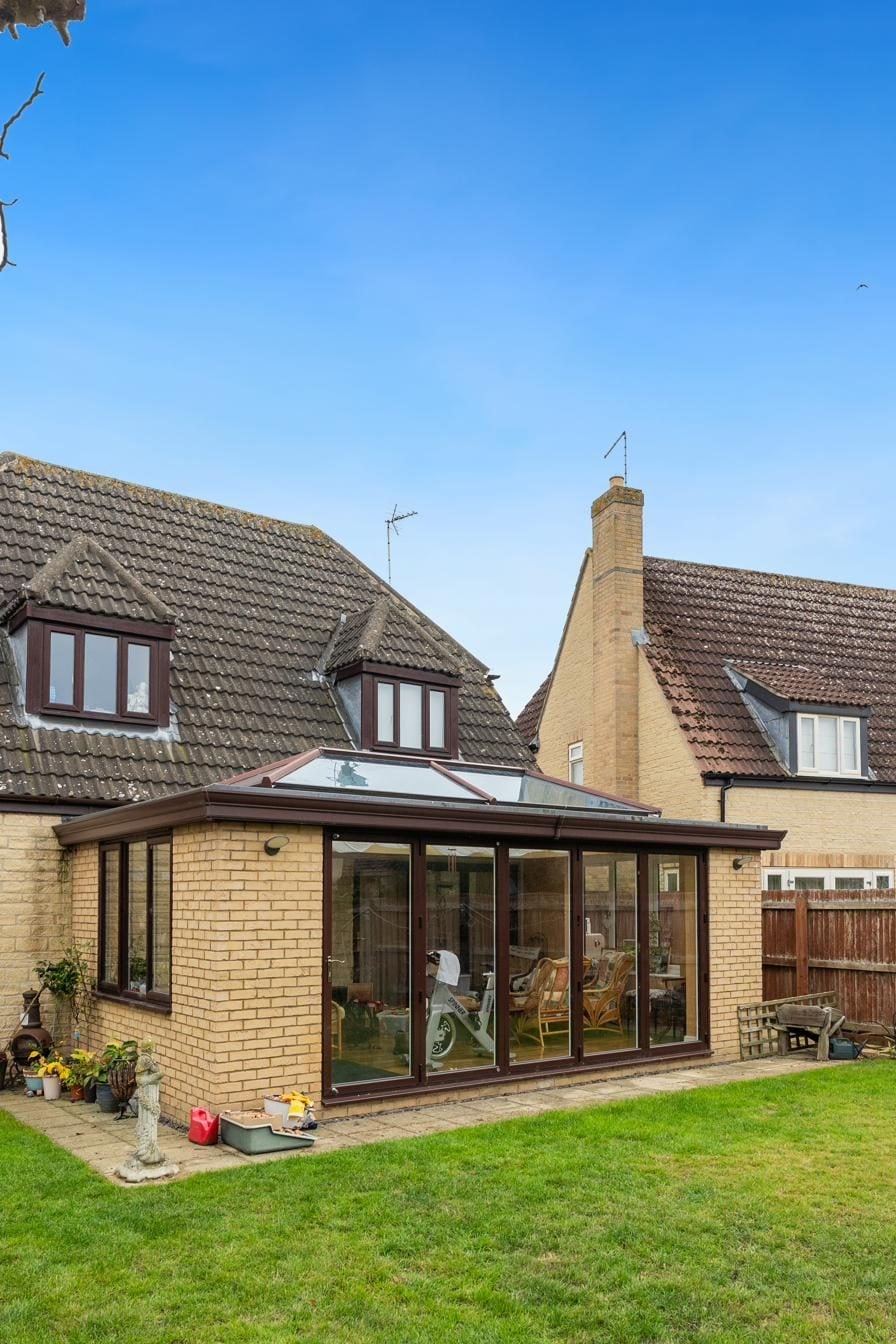 Sympathetic conservatory and lantern roof on a stone home outside Stamford
