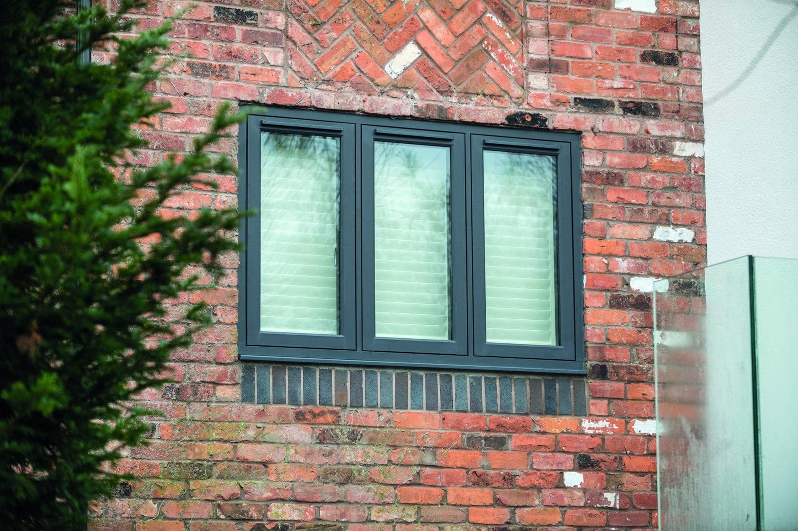 Residence Collection R² anthracite flush sash windows on a period brick property