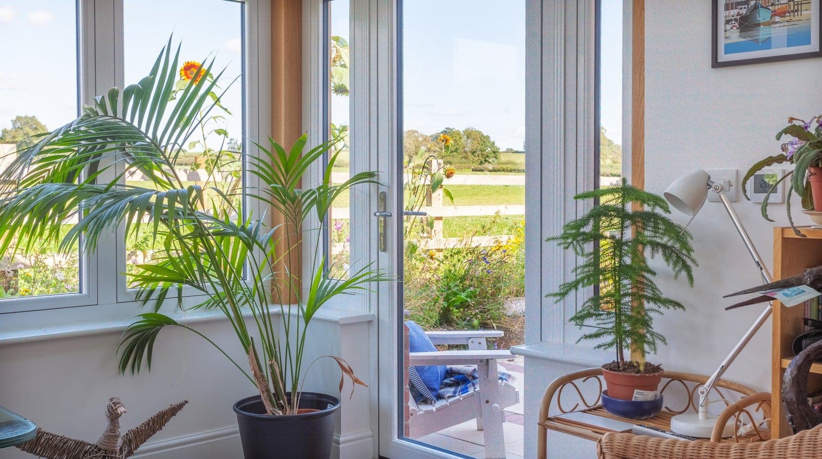 Residence 7 Chalk White flush-sash uPVC windows seen from inside, looking out to a garden
