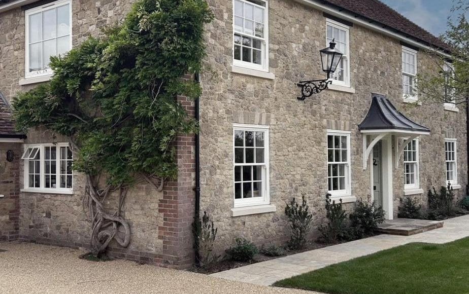 Rose Collection sash windows fitted across a Cotswold stone country home
