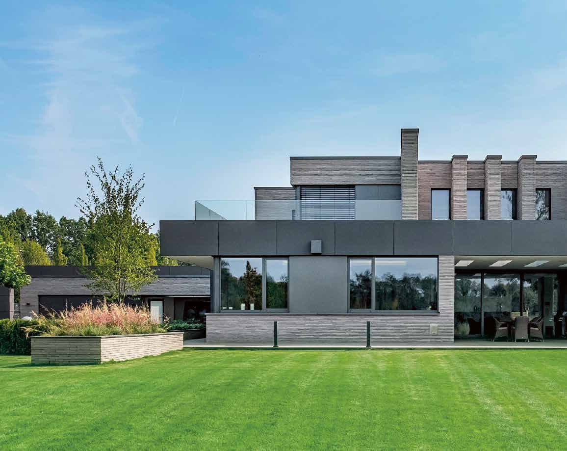 Schüco aluminium windows and sliding doors across the rear elevation of a contemporary villa