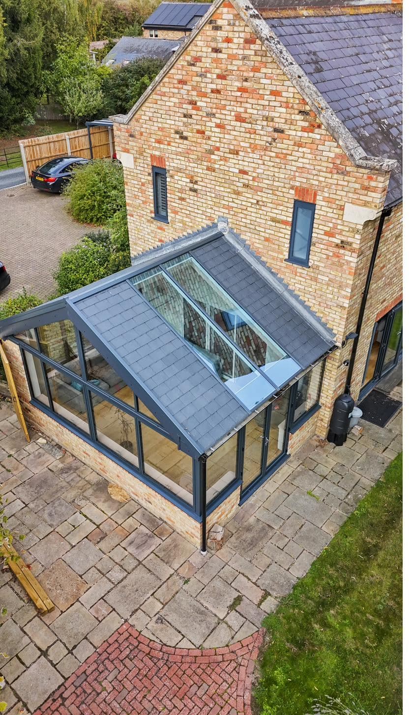 Aerial view of an orangery extension with tiled roof and twin glass roof lanterns — full install by Custom Choice