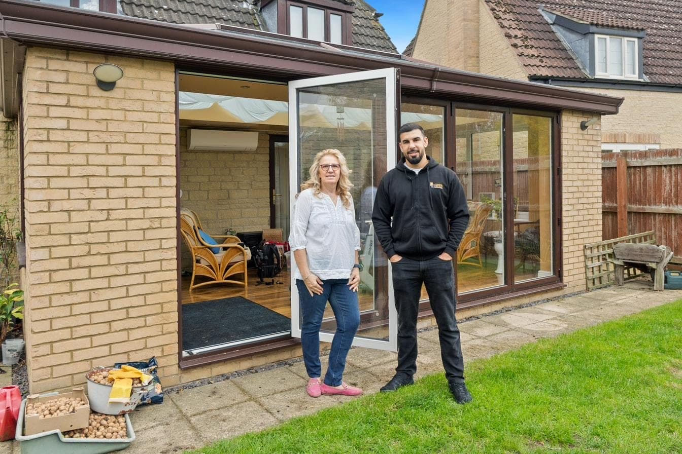 Tariq Quaddus of Custom Choice with a Peterborough homeowner at the handover of her new conservatory