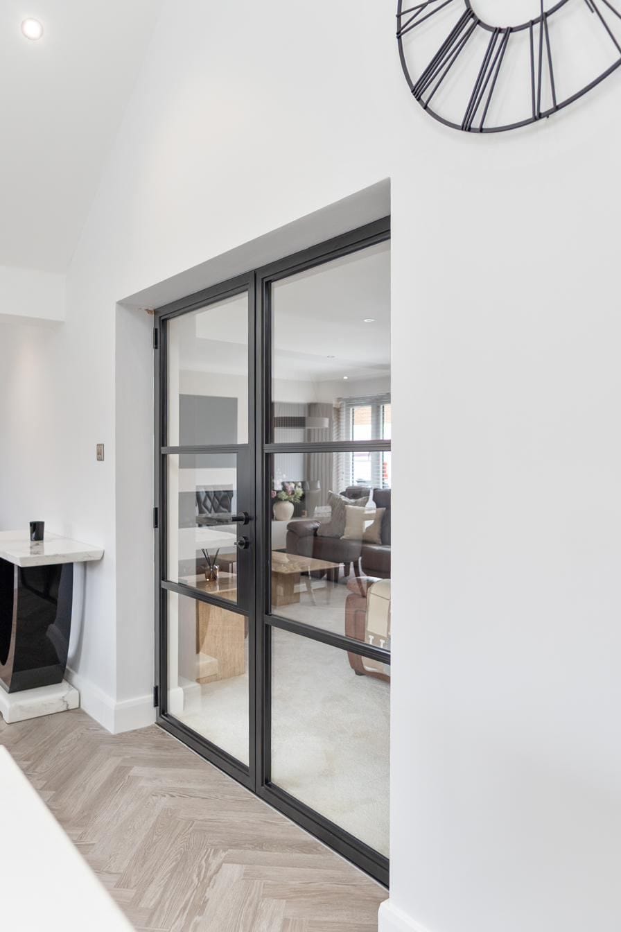 Crittal-style aluminium doors with slim sightlines on a heritage property