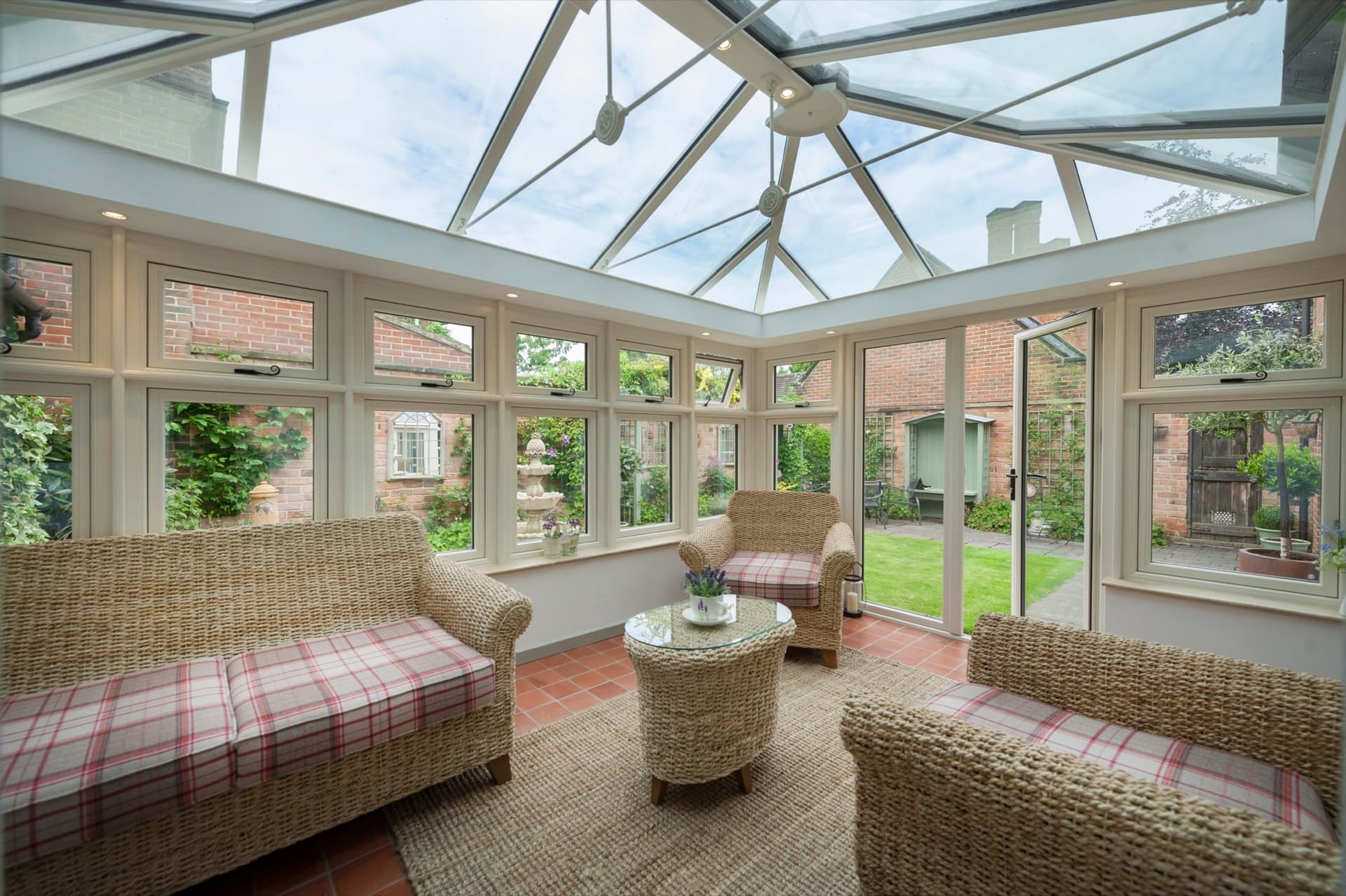Victorian conservatory interior with bay-fronted glazing and traditional ridge roof