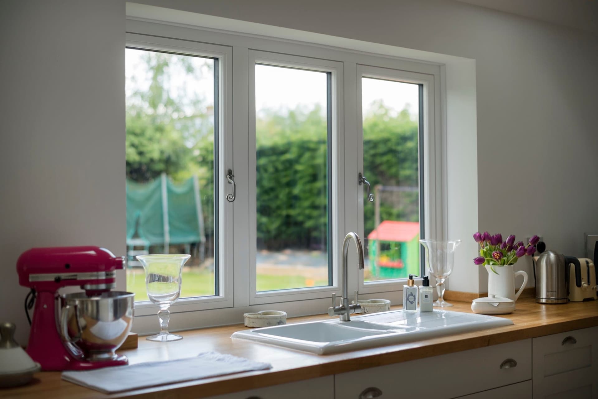 White uPVC casement window above a kitchen sink