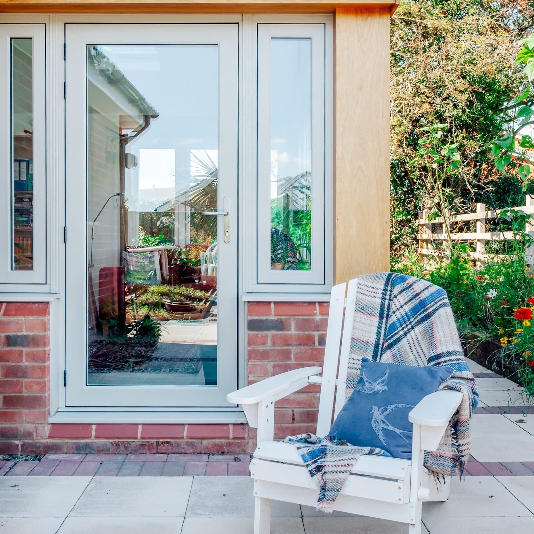 Painswick French doors leading to a sunlit terrace