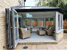 Image of newly built conservatory with folding exterior doors open